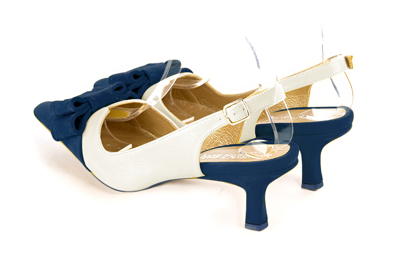 Navy blue and off white women's open back shoes, with a knot. Tapered toe. Medium spool heels. Rear view - Florence KOOIJMAN